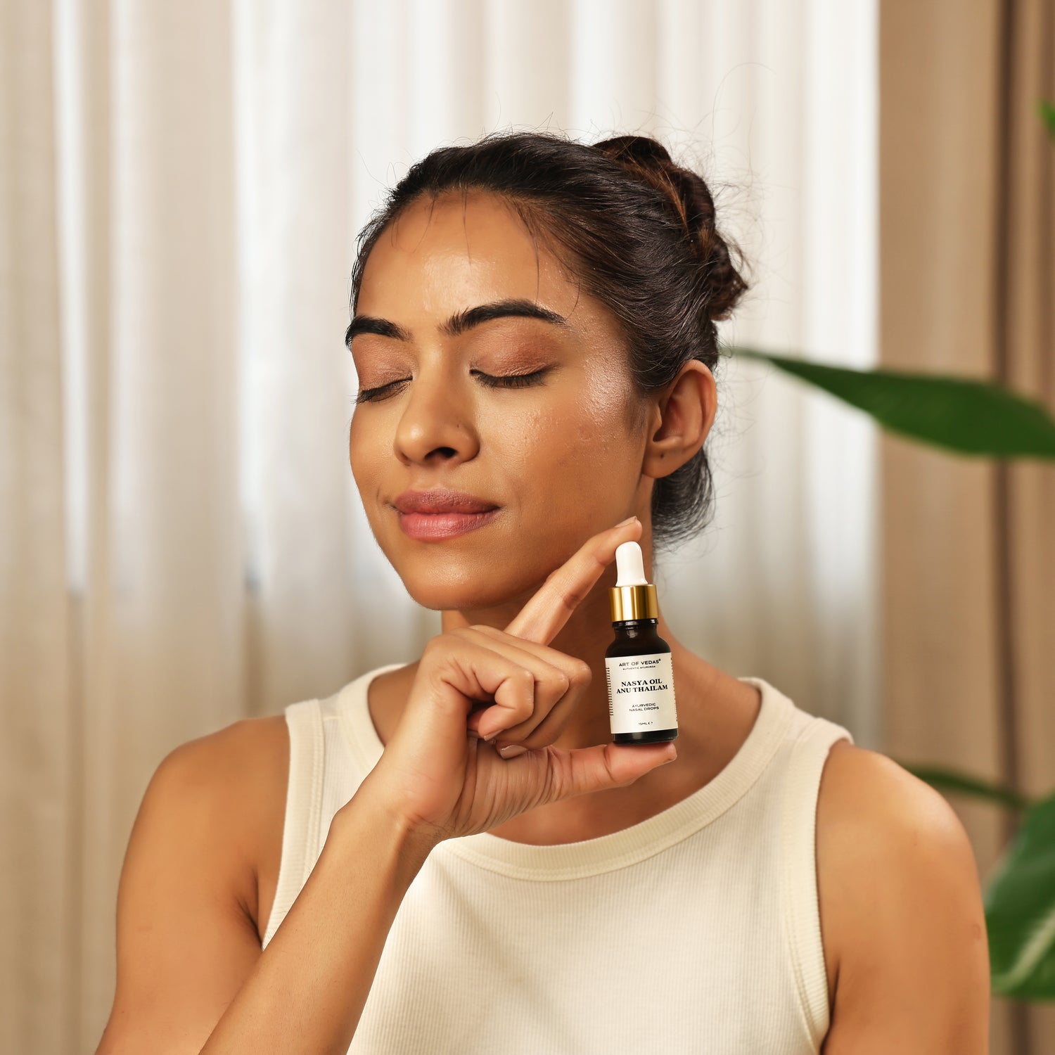 Art of Vedas Nasya Anu Thailam Ayurveda - Woman Holding Nasya Oil Dropper Bottle for Nasal Care and Sinus Health